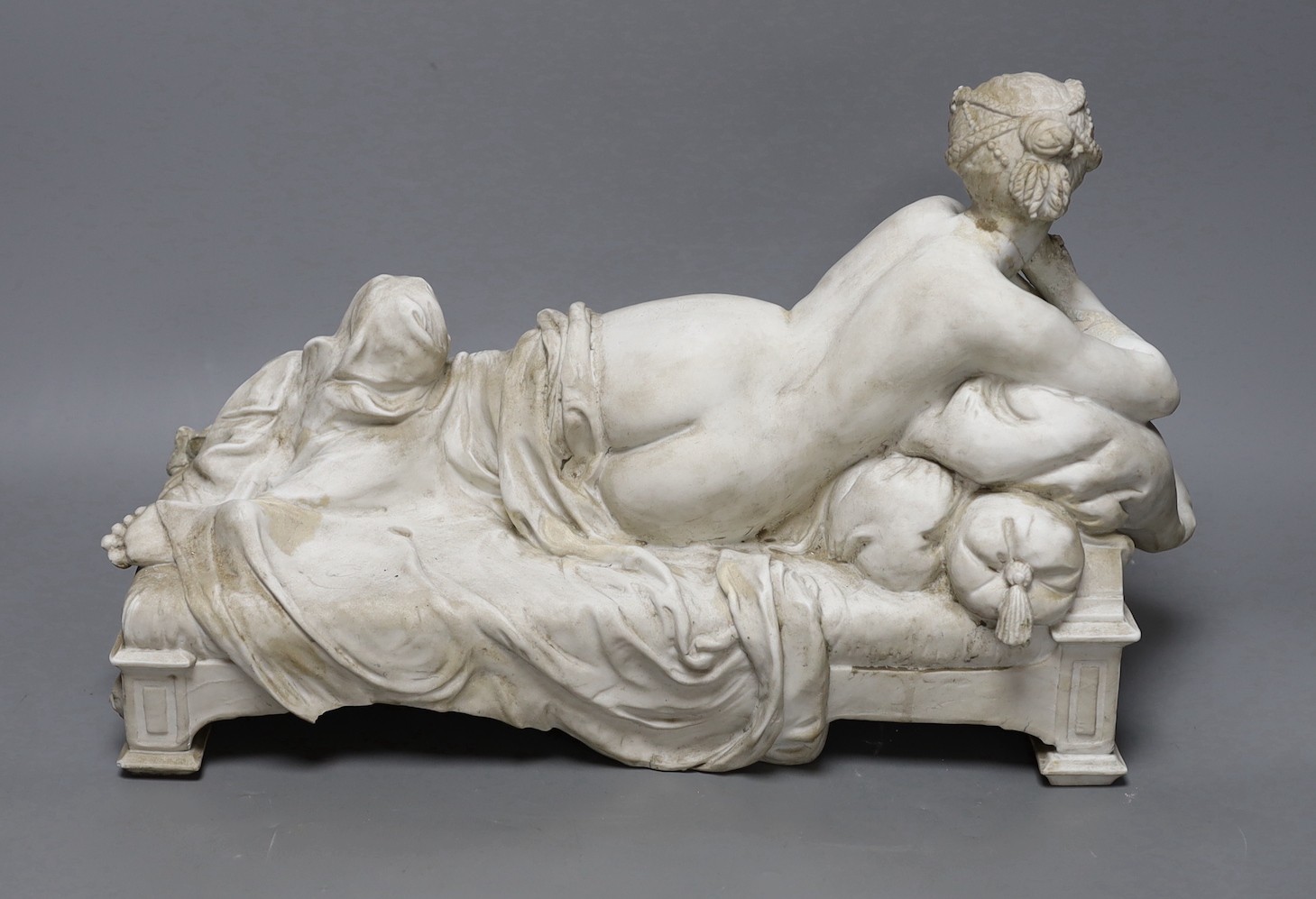 A 19th century French biscuit porcelain reclining figure, perhaps Pauline, 41cm long